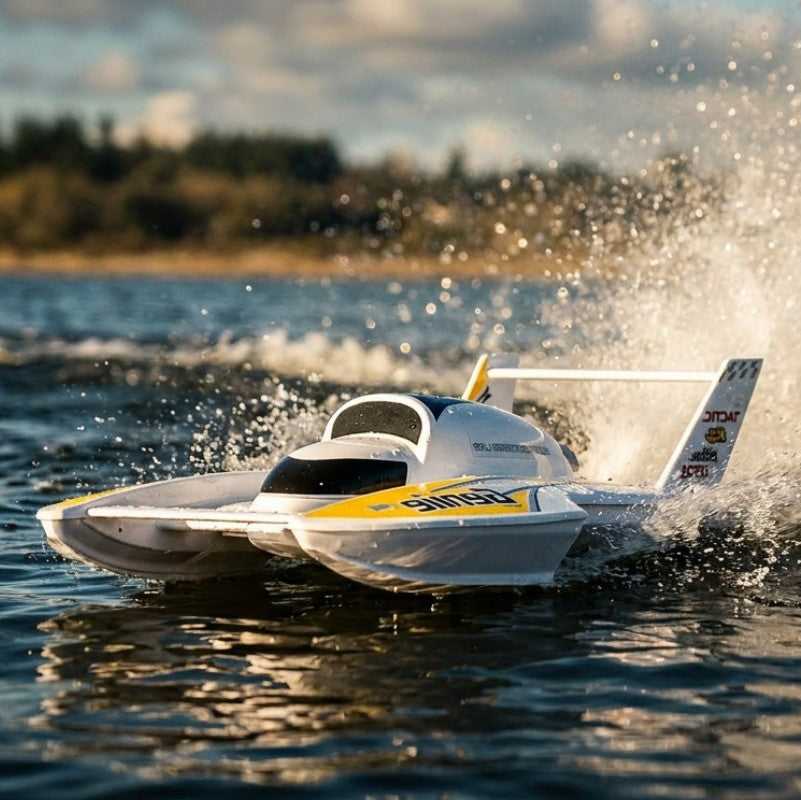 White and yellow hydrofoil boat speeding across water with a blurred background